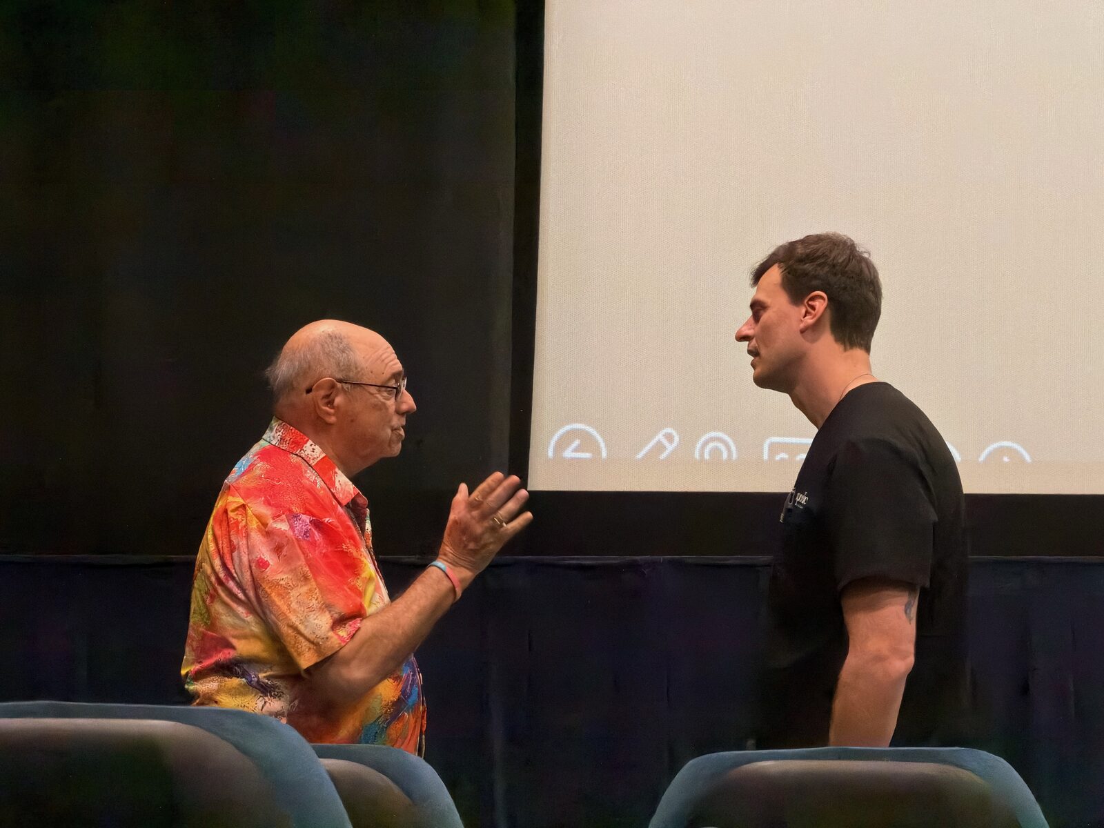 Dr. Tyler Long, DO talks with a Villages resident after the lecture.